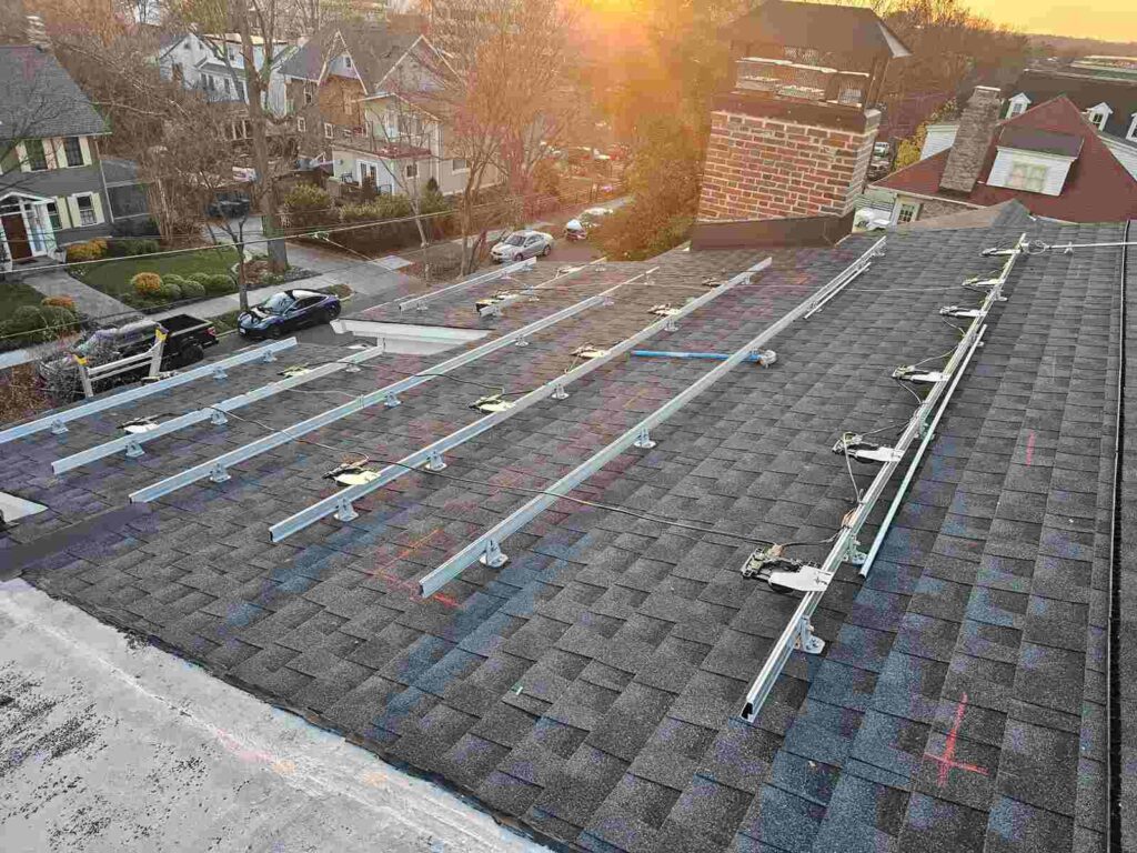 A solar racking system on a pitched shingle roof.