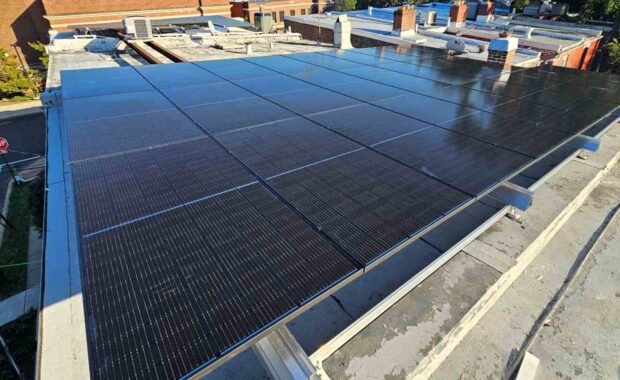 Blue solar panels on a flat roof.
