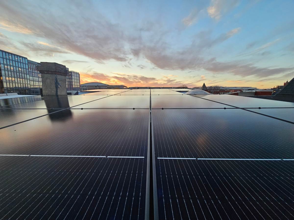 all black solar panels on a flat roof Uprise Solar