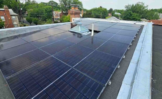 Blue solar panels on a flat roof.