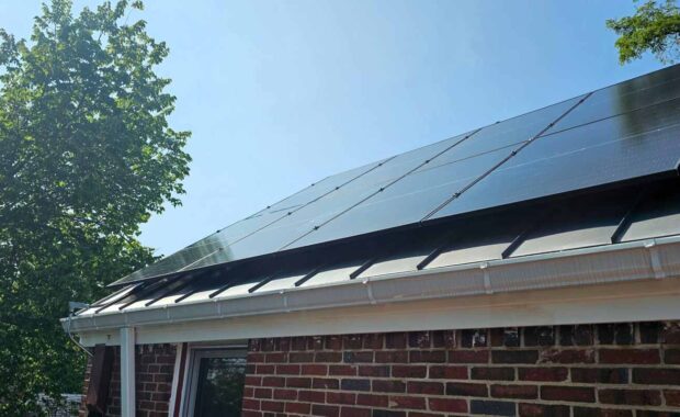 Solar panels on a brick house.