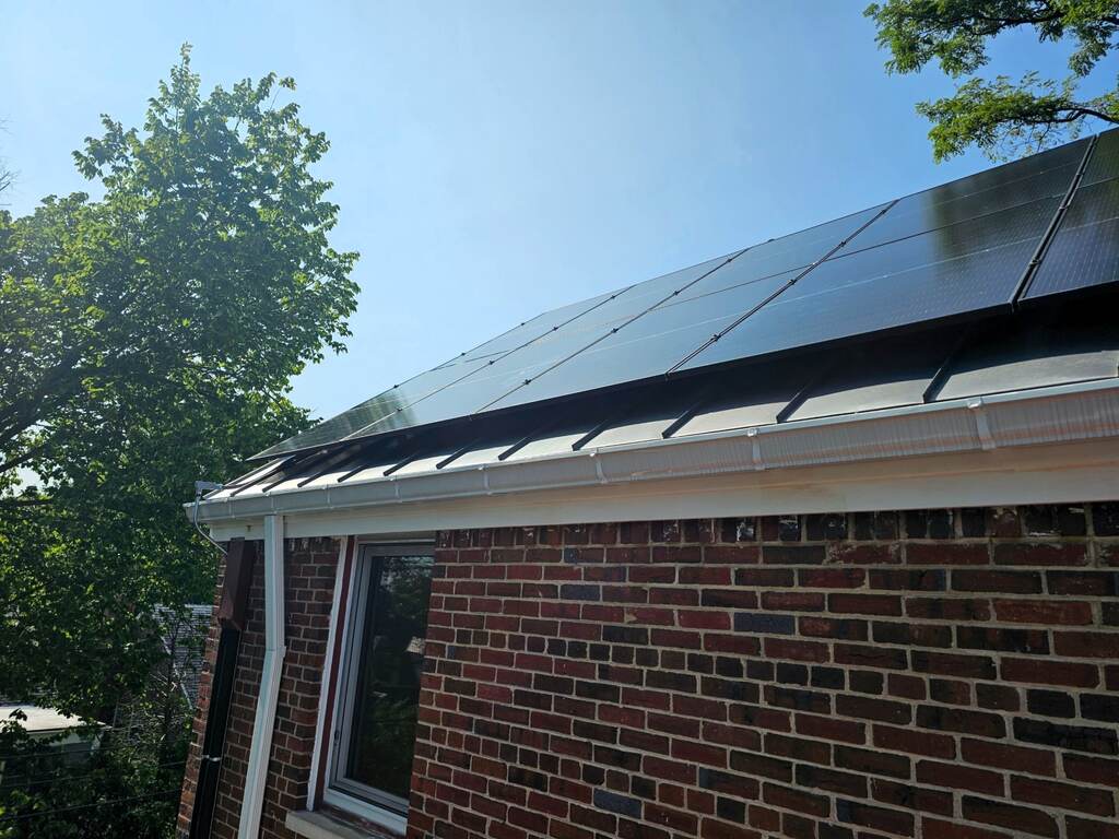 Solar panels on a brick home.