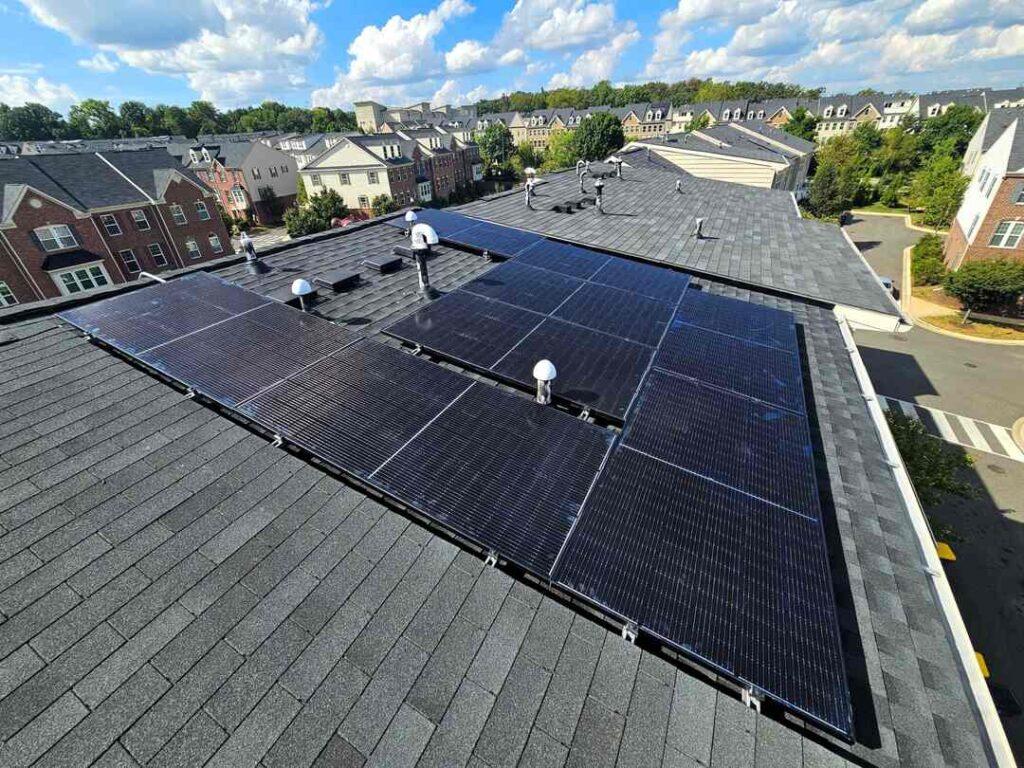 Solar panels on a pitched shingle roof.