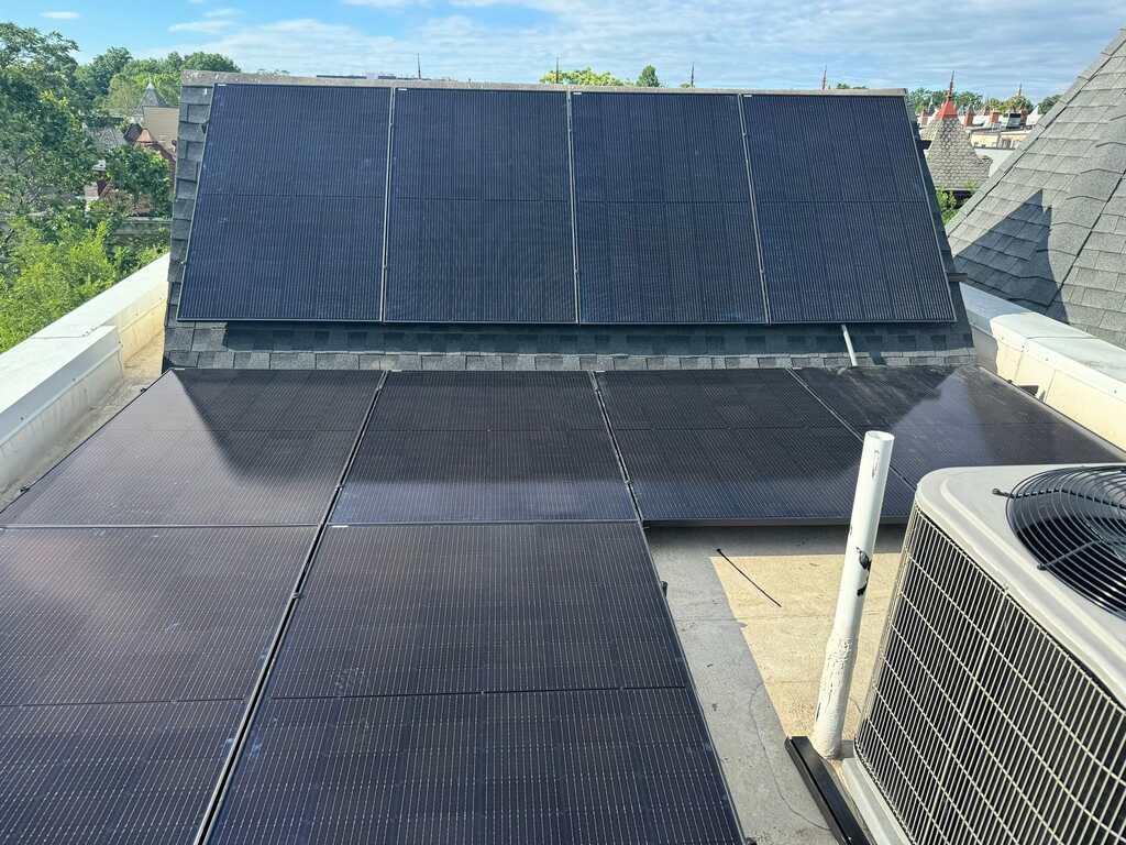 Solar panels on a pitched and flat roof.