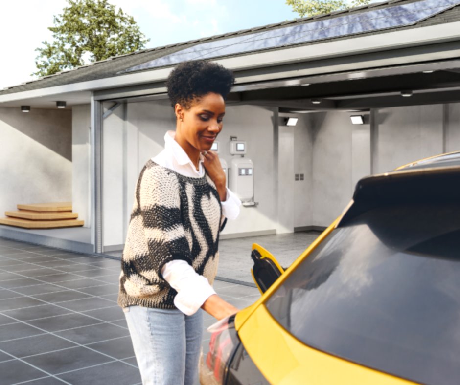 Woman charging her EV with solar energy