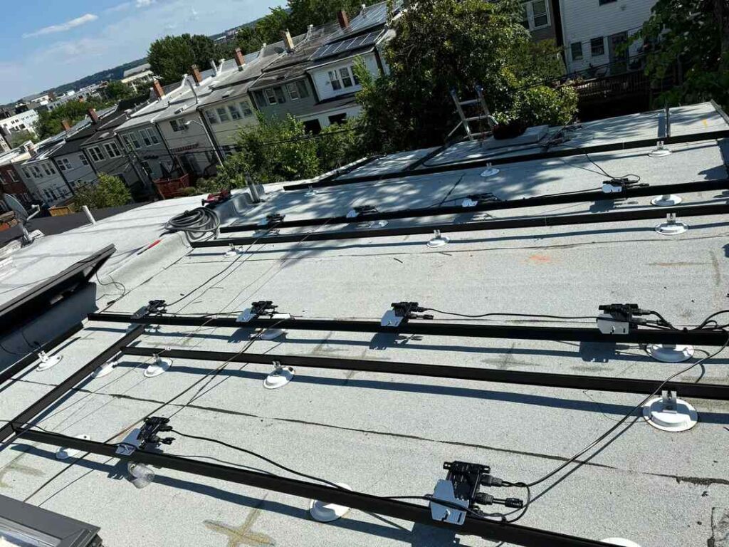 Solar racking and microinverters, installed before the solar panels.