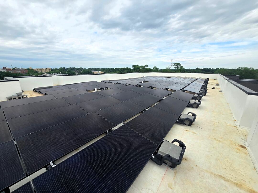 A large solar array on a flat rooftop in Maryland.