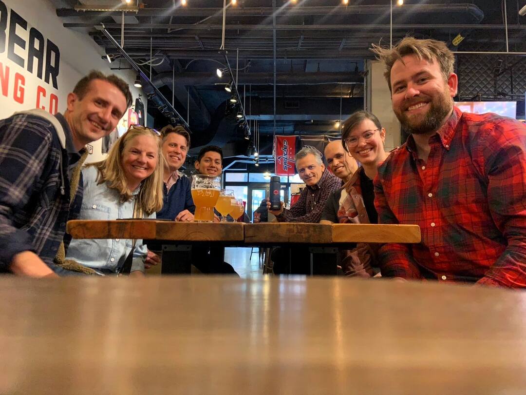 Team members at Uprise solar gather for lunch at a local brewery.