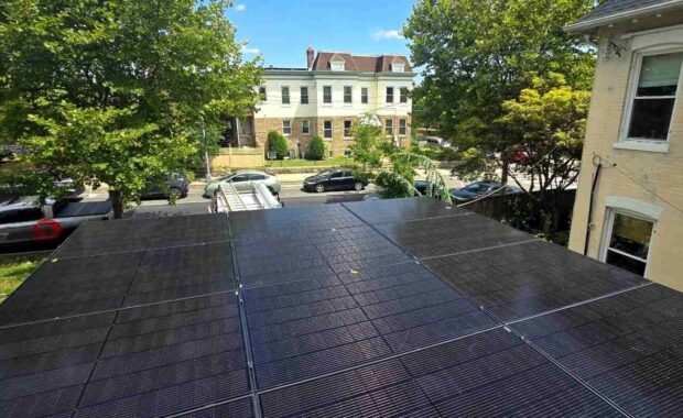 Solar panels in Northwest DC under a blue sky.