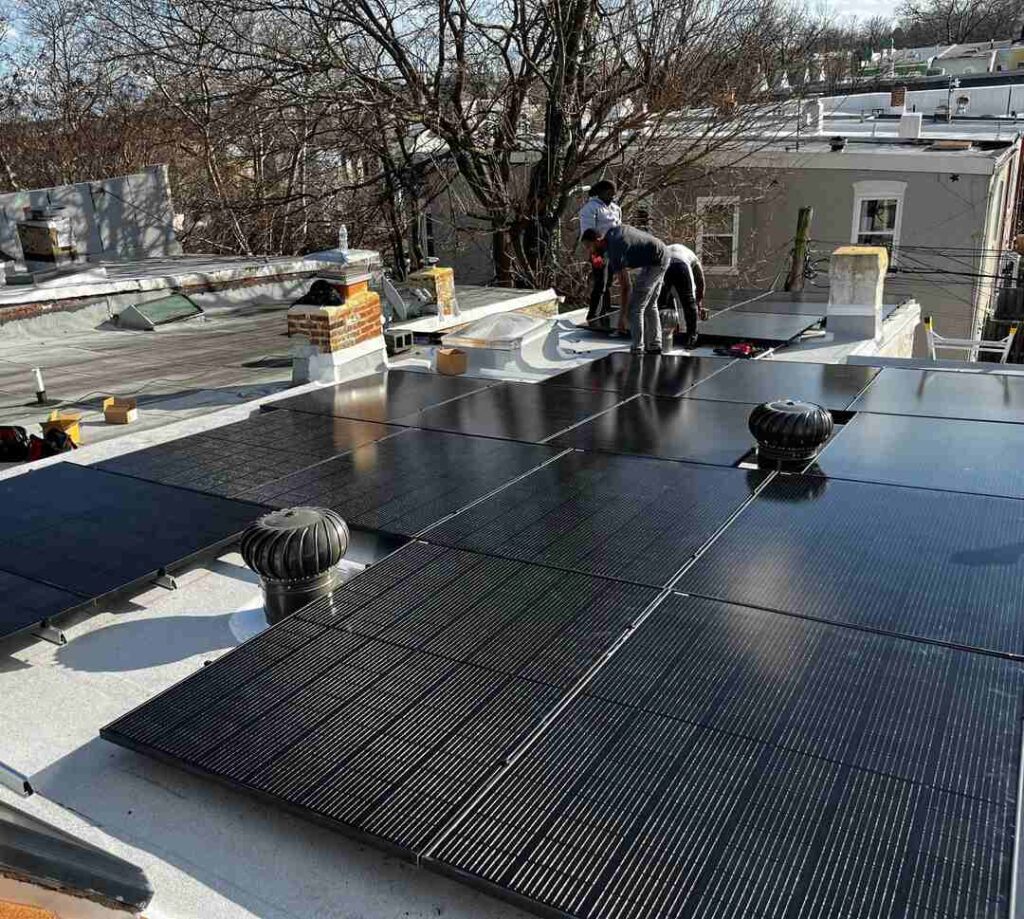 Solar installers near a completed solar array.