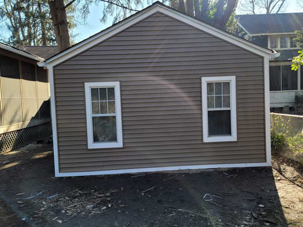 New siding on a Silver Spring, Maryland garage for a roofing project.