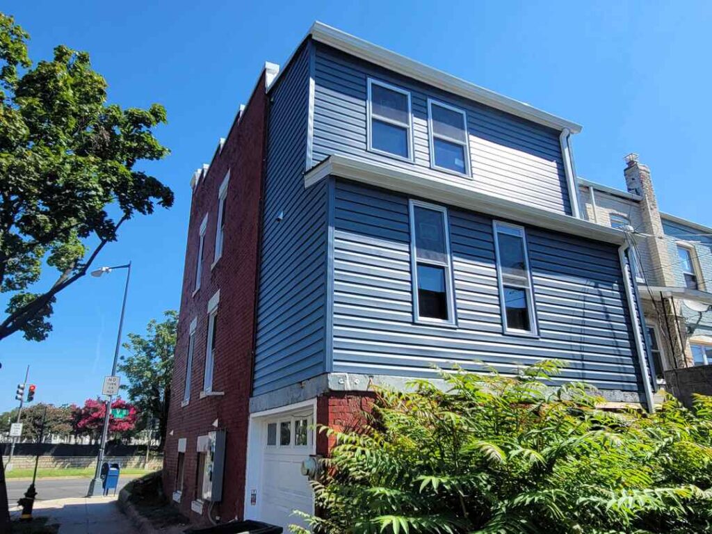 Brand new blue siding on a Washington, DC family home.