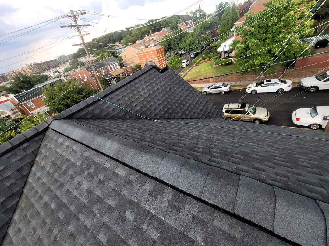 New architectural shingles on a steep DC roof.