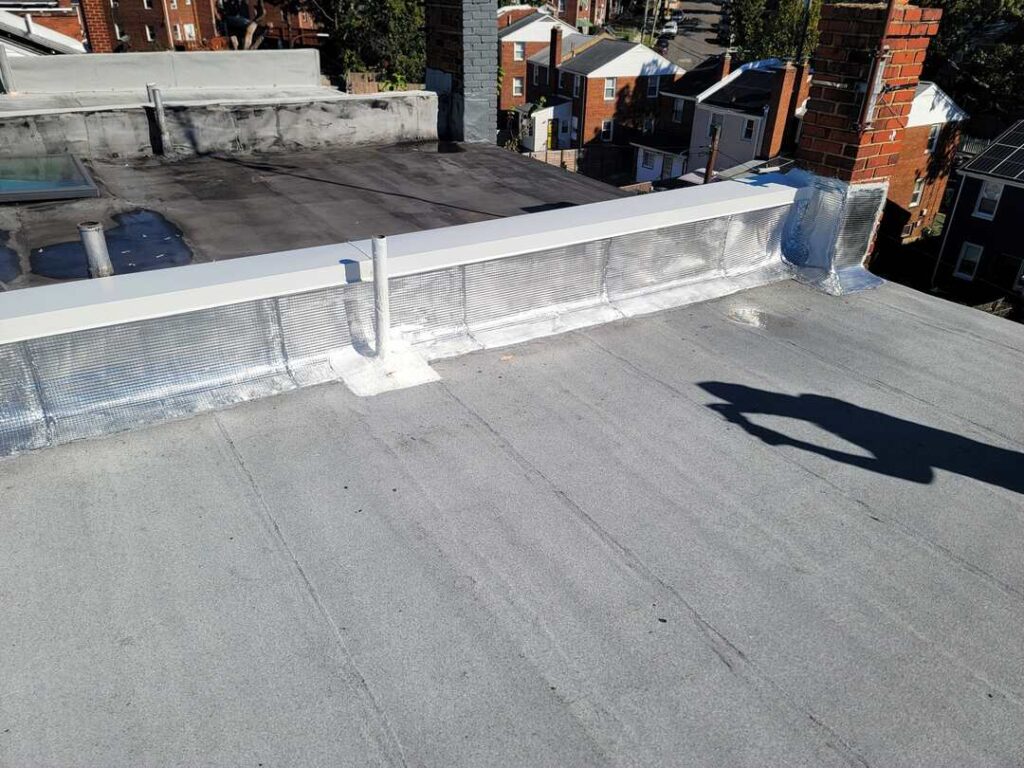 A new flat roof in Washington, DC with aluminum flashing.