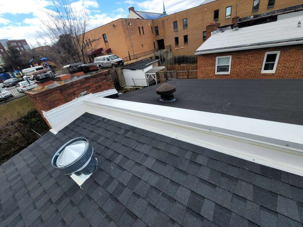 Architectural shingles with a TPO flashing wall.