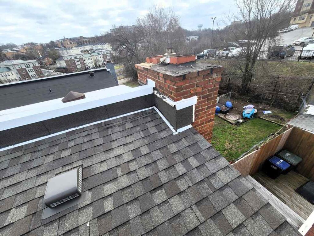 This roofing project includes polyglass flashing and a white coping cap.