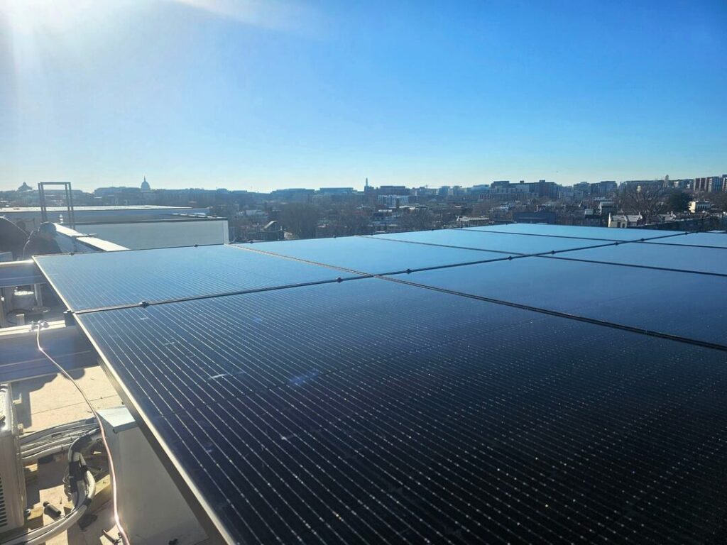 Solar panels under blue skies and sunshine in Washington, DC.